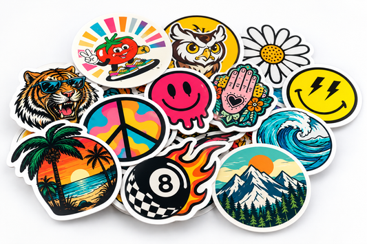Collection of colorful custom vinyl stickers including a tiger, smiley faces, flowers, an 8-ball and mountain designs
